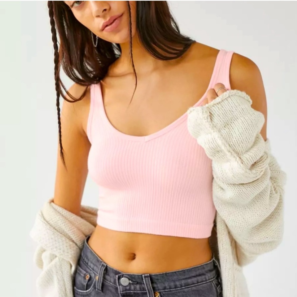 light pink out from under Urban Outfitters tank top